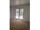 Bedroom with double doors leading to outside at 14794 E 2Nd Ave # 111F, Aurora, CO 80011