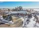 Aerial view of house, detached garage, and driveway at 13820 E 133Rd Dr, Brighton, CO 80601