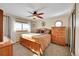 Spacious bedroom with wood furniture and a view at 13820 E 133Rd Dr, Brighton, CO 80601