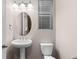 Clean bathroom with pedestal sink and updated fixtures at 23630 E 5Th Pl, Aurora, CO 80018