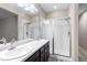 Bathroom with double sinks, large mirror and shower at 23630 E 5Th Pl, Aurora, CO 80018
