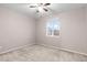 Spacious bedroom with ceiling fan and neutral carpeting at 23630 E 5Th Pl, Aurora, CO 80018
