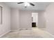 Primary bedroom with ensuite bathroom access and ceiling fan at 23630 E 5Th Pl, Aurora, CO 80018