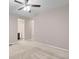 Primary bedroom with ensuite bathroom access and ceiling fan at 23630 E 5Th Pl, Aurora, CO 80018