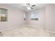 Bright bedroom featuring carpeted floor and ceiling fan at 23630 E 5Th Pl, Aurora, CO 80018