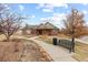 Community clubhouse with landscaping and walkway at 23630 E 5Th Pl, Aurora, CO 80018