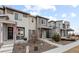 Three-story townhouses with front porches at 23630 E 5Th Pl, Aurora, CO 80018