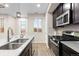 Modern kitchen with stainless steel appliances and granite countertops at 23630 E 5Th Pl, Aurora, CO 80018