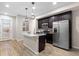 Modern kitchen with stainless steel appliances and an island with seating at 23630 E 5Th Pl, Aurora, CO 80018