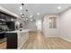 Open concept kitchen with island and stainless steel appliances at 23630 E 5Th Pl, Aurora, CO 80018