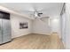 Spacious living room with wood-look floors and ceiling fan at 23630 E 5Th Pl, Aurora, CO 80018