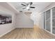 Bright living room with wood-look floors and sliding glass doors at 23630 E 5Th Pl, Aurora, CO 80018