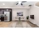 Open concept living room with a modern aesthetic and access to a balcony at 23630 E 5Th Pl, Aurora, CO 80018