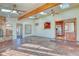 Open concept sunroom with kitchen passthrough and brick floor at 485 Garrison St, Lakewood, CO 80226