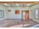 Sunroom with kitchen passthrough and brick floors at 485 Garrison St, Lakewood, CO 80226