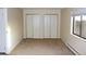 Spacious bedroom with large closets and neutral carpeting at 13890 E Marina Dr # 612, Aurora, CO 80014