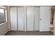 Bedroom with large closet featuring sliding mirrored doors at 13890 E Marina Dr # 612, Aurora, CO 80014