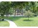 Community swimming pool with surrounding lawn and walkway at 13890 E Marina Dr # 612, Aurora, CO 80014