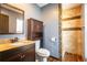 Bathroom with granite vanity, tiled shower, and updated fixtures at 110 Lucerne Dr, Lafayette, CO 80026