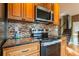 Updated kitchen with stainless steel appliances and granite countertops at 110 Lucerne Dr, Lafayette, CO 80026