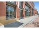 Brick building with large windows and glass doors, showcasing a modern design at 1499 Blake St # 1A & 1B, Denver, CO 80202