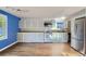 Kitchen with grey cabinets and stainless steel appliances at 425 Crystal Pl, Longmont, CO 80504