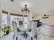 Dining area with round table and chairs, adjacent to kitchen at 9765 Hannibal Ct, Commerce City, CO 80022