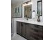 Modern bathroom vanity with dark wood cabinets and white countertop at 3916 N Raleigh St, Denver, CO 80212