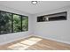 Bright bedroom with large windows and hardwood floors at 3916 N Raleigh St, Denver, CO 80212