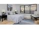 Cozy bedroom with a comfortable bed, nightstands, and large window at 3916 N Raleigh St, Denver, CO 80212