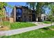 Modern two-story home with a landscaped front yard and a paved walkway at 3916 N Raleigh St, Denver, CO 80212