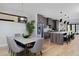 Open-concept kitchen and dining area with modern finishes at 3916 N Raleigh St, Denver, CO 80212