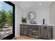 Wet bar with beverage cooler and access to a balcony at 3916 N Raleigh St, Denver, CO 80212