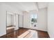 Bright bedroom with hardwood floors and window view at 8060 E Girard Ave # 419, Denver, CO 80231