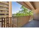 Private balcony overlooking trees and buildings at 8060 E Girard Ave # 419, Denver, CO 80231