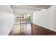 Living room with hardwood floors and sliding door to balcony at 8060 E Girard Ave # 419, Denver, CO 80231