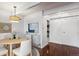 Bright dining area with hardwood floors and a view of the kitchen at 8060 E Girard Ave # 419, Denver, CO 80231