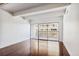 Bright living room with hardwood floors and sliding glass door to balcony at 8060 E Girard Ave # 419, Denver, CO 80231