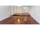 Spacious living area featuring hardwood floors and elevated platform at 8060 E Girard Ave # 419, Denver, CO 80231