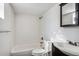 Clean bathroom with a bathtub, toilet, and dark vanity at 8060 E Girard Ave # 419, Denver, CO 80231