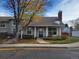 Gray exterior of charming house with autumn landscaping and walkway at 7031 S Knolls Way, Centennial, CO 80122