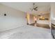 Living room with carpeted floors, a fireplace, and an open layout connecting to the dining area at 2971 W 119Th Ave # 204, Westminster, CO 80234