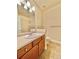 Clean bathroom with updated vanity and neutral tile floors at 1076 Rosemary St, Denver, CO 80230