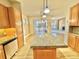 Kitchen island view showcasing access to the Gathering room and backyard at 1076 Rosemary St, Denver, CO 80230