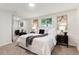 Main bedroom with king-size bed and access to private sitting area at 210 E Graves Ave, Centennial, CO 80121