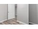 Finished basement bedroom with door to hallway at 6509 S Yukon St, Littleton, CO 80123