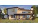 Contemporary home with backyard patio and outdoor kitchen at 5292 Lions Paw St, Castle Rock, CO 80104