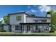 Contemporary home with backyard patio and outdoor kitchen at 5292 Lions Paw St, Castle Rock, CO 80104