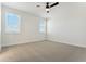 Bright bedroom with neutral carpeting and ceiling fan at 42982 Colonial Trl, Elizabeth, CO 80107