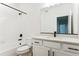 Modern bathroom with white vanity, bathtub, and black fixtures at 42982 Colonial Trl, Elizabeth, CO 80107